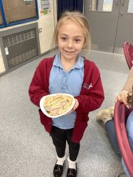Child with a pasta salad.