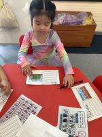 Child writing a mothers day card