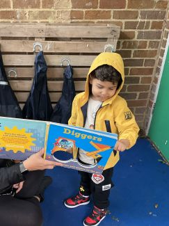 Child reading in the nursery
