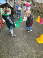 Child catching a large ball