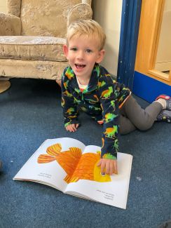 Child reading in the nursery