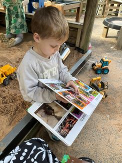 Child reading in the nursery