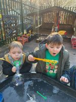 Child blowing bubbles