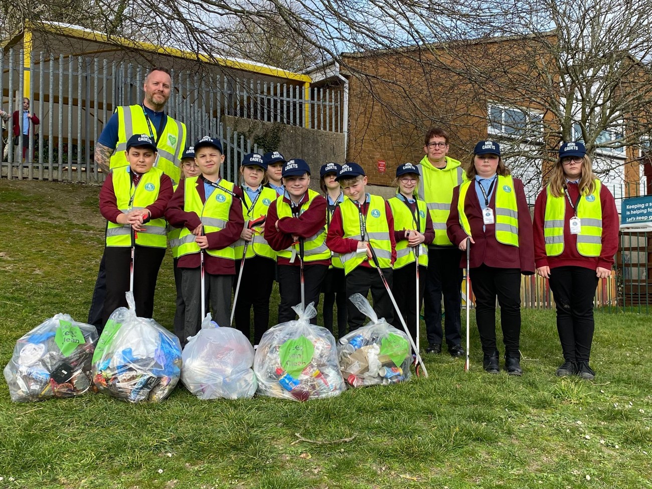 Children with litter bags - after picking up litter