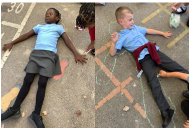 Pupils being drawn around with chalk 